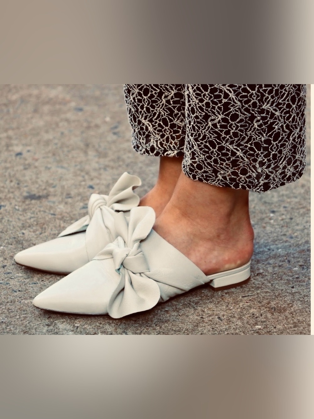 Nanette Lepore leather flat mules. Pointed toe asymmetric knotted bow. Cream 8.5